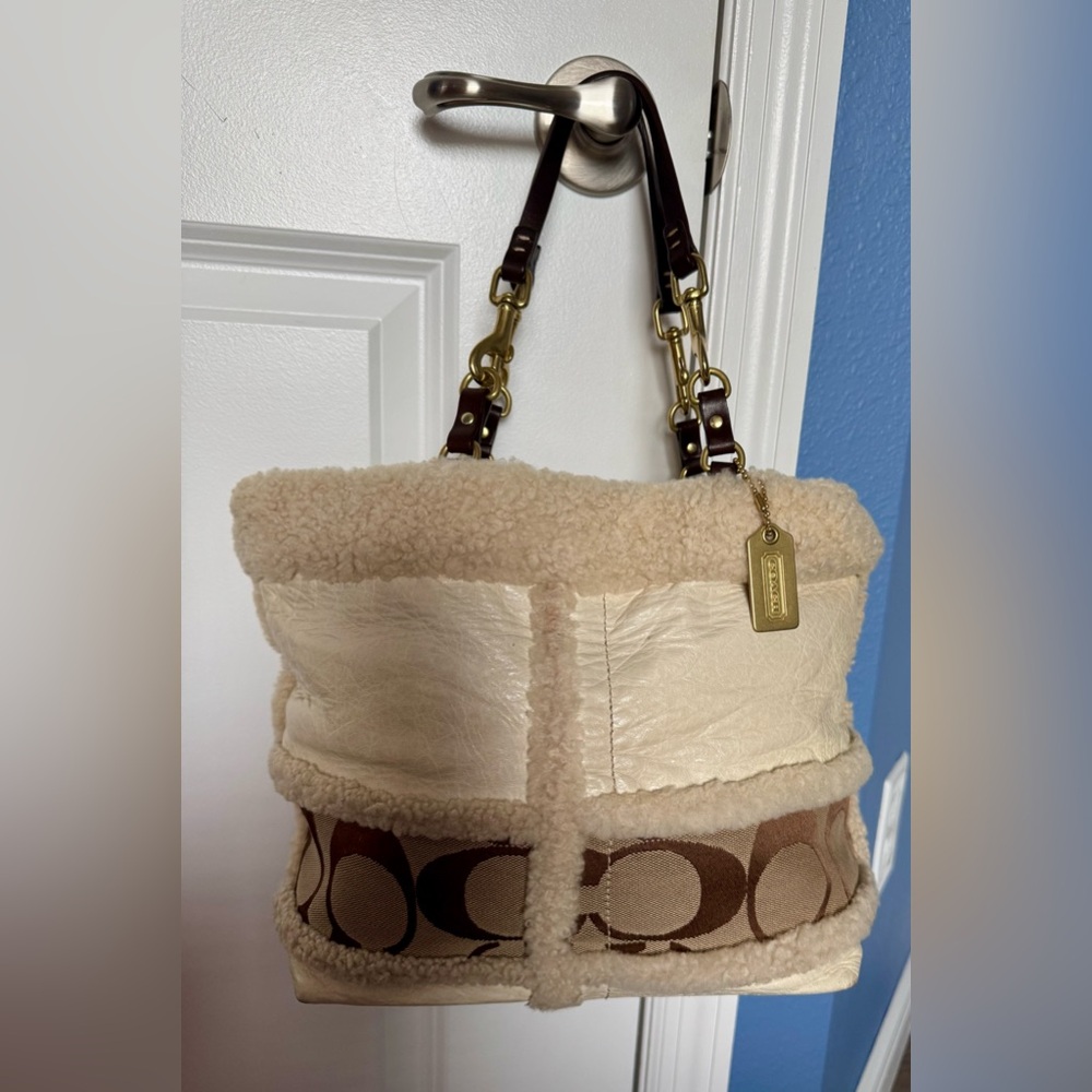 Authentic Coach limited edition cream handbag with Shearling trim.